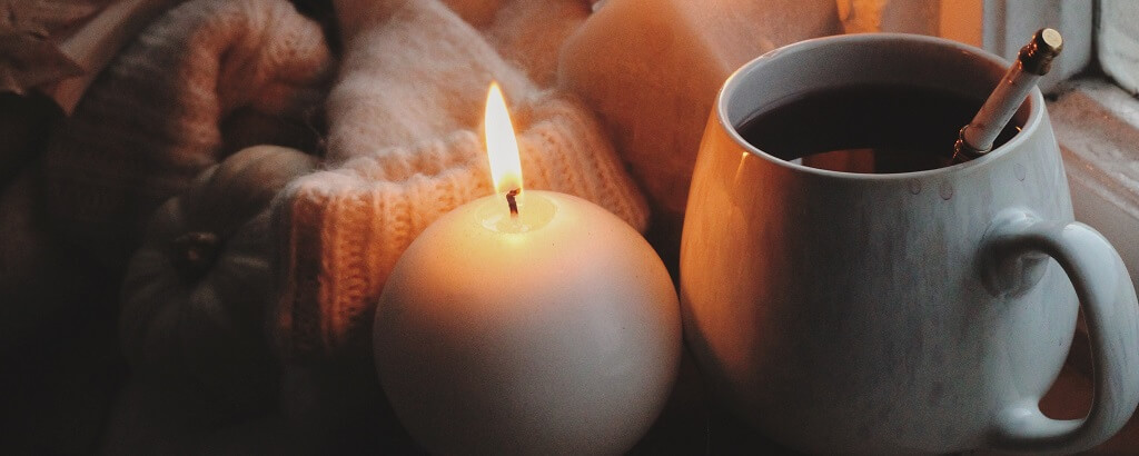 hot drink and candles to keep warm in winter