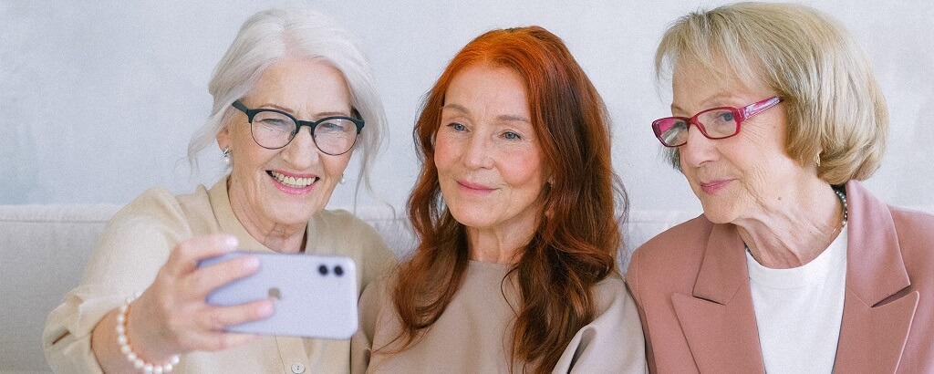 stylish ladies using mobile phones for the elderly