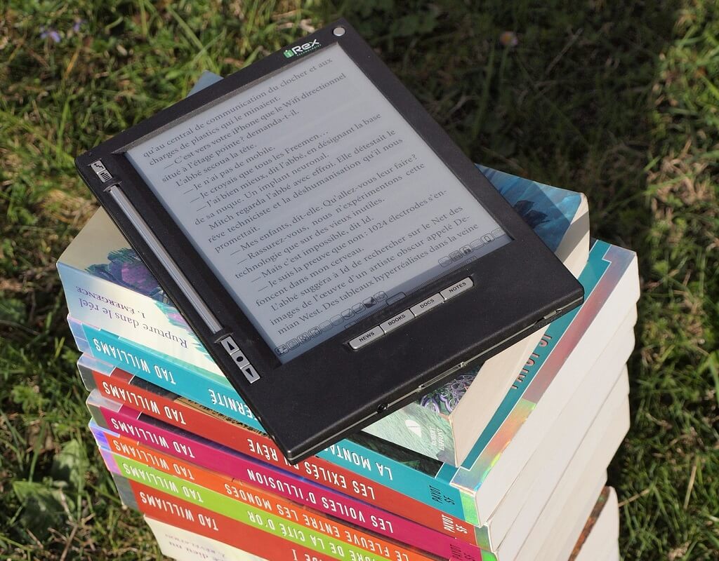 ereader on a stack of books, a great example of mother's day gifts