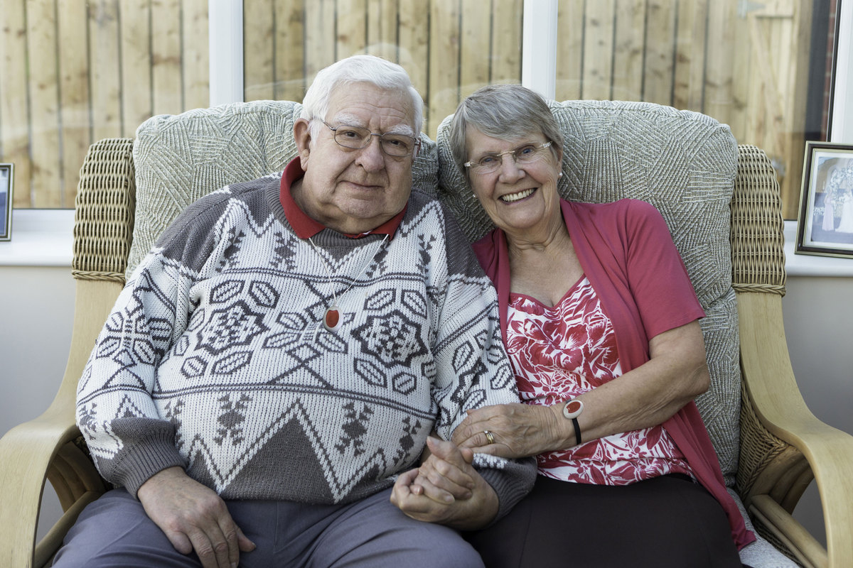 An elderly couple wearing their Carelink24 Pendants