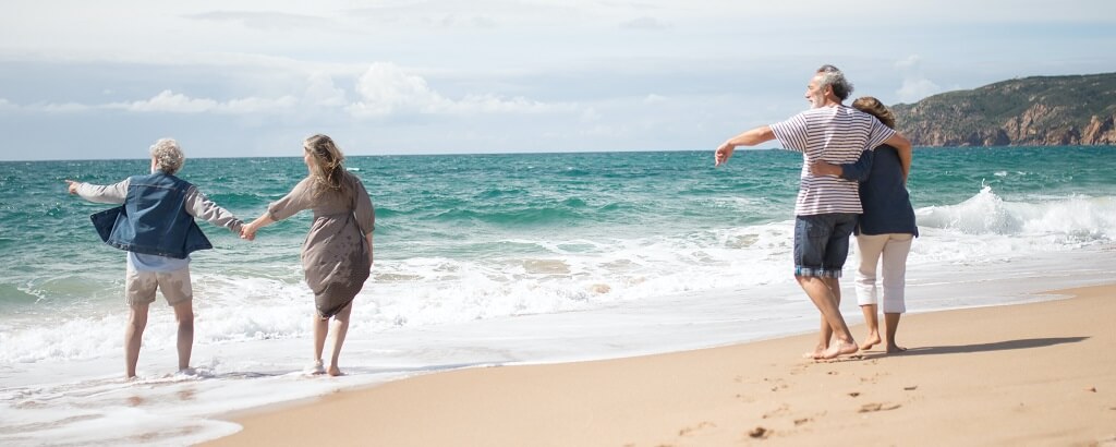 elderly friends enjoying simple days out at the beach